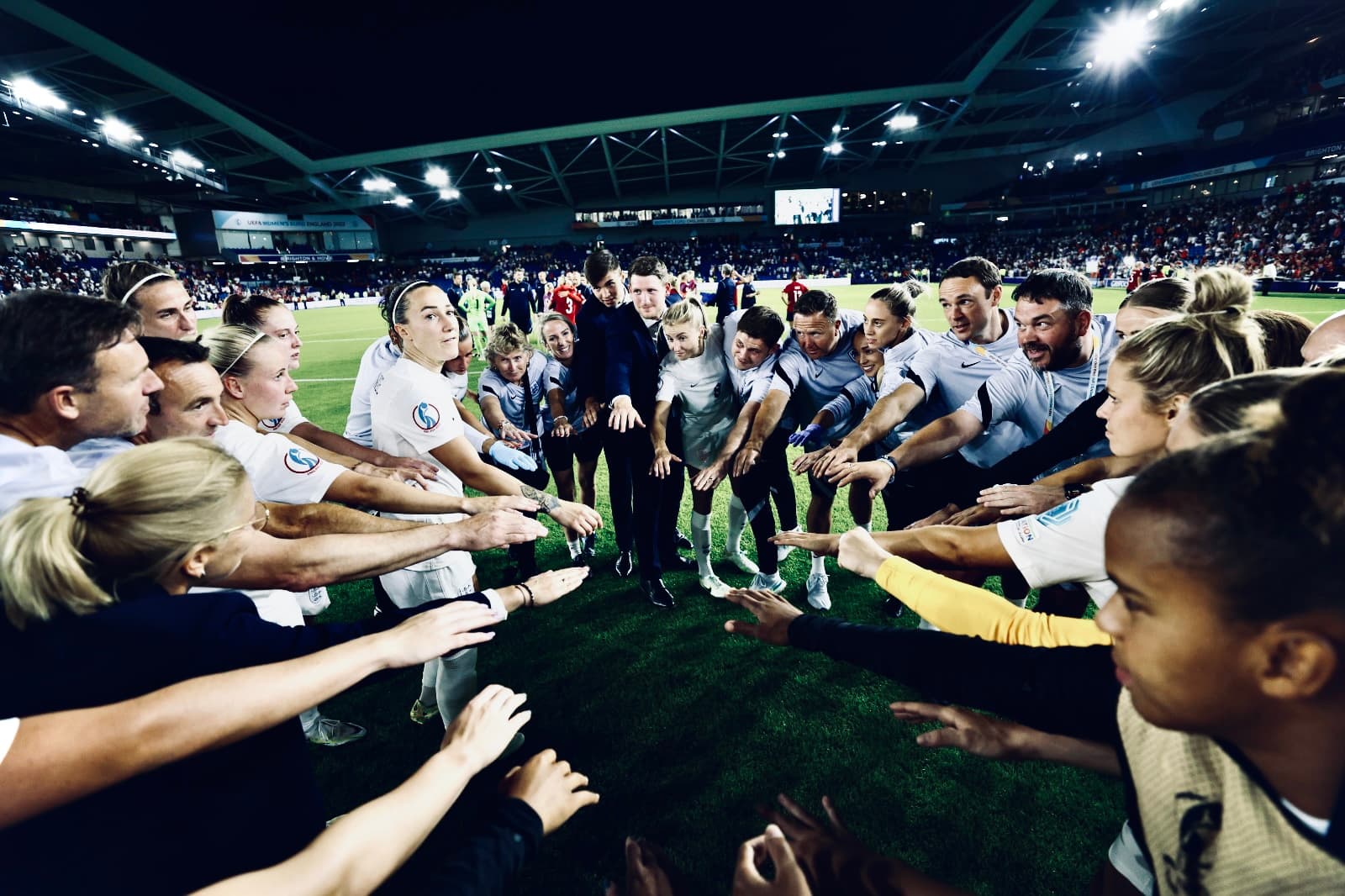 The Lionesses in a huddle during a match