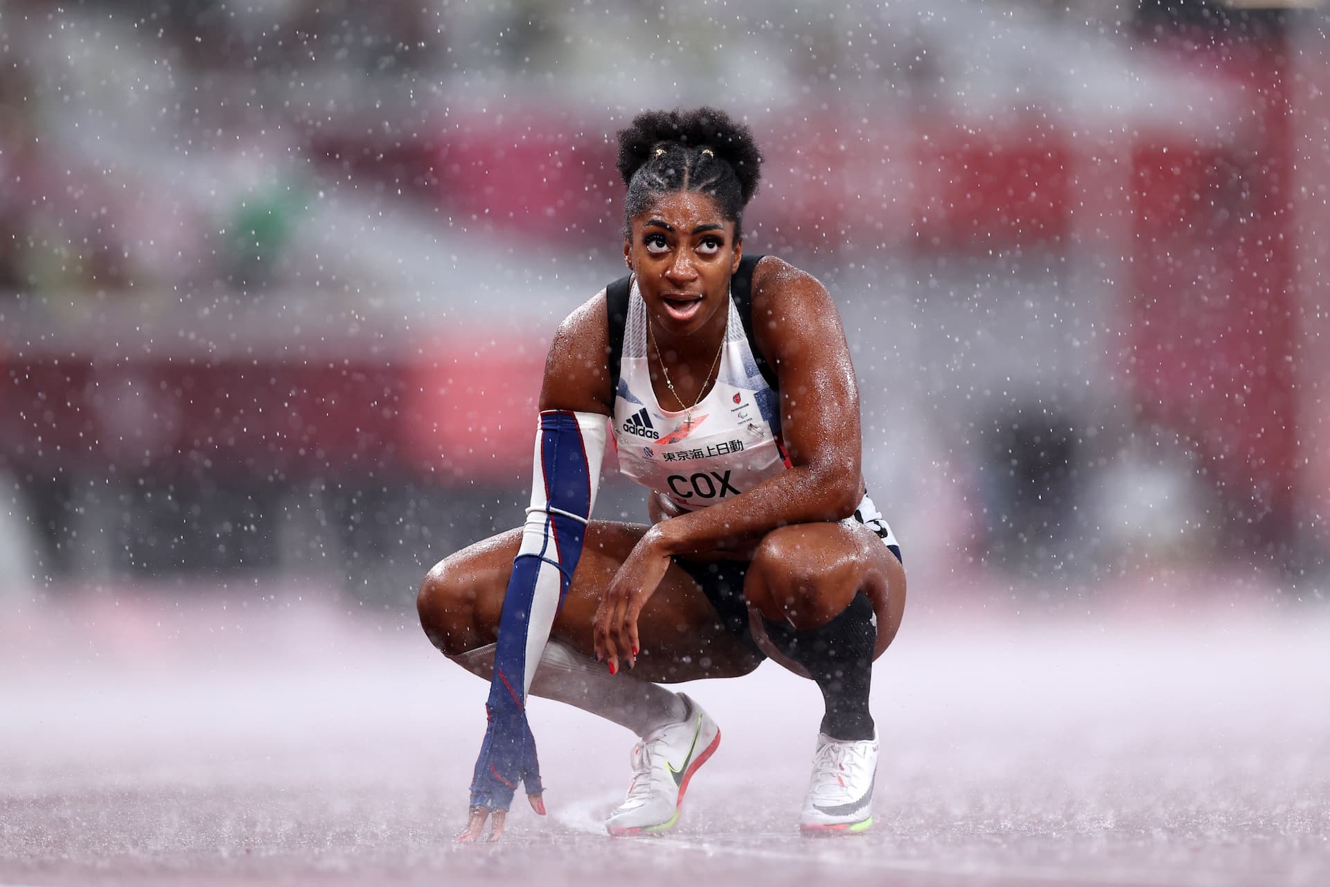 Parasport athlete Kadeena Cox crouching on track